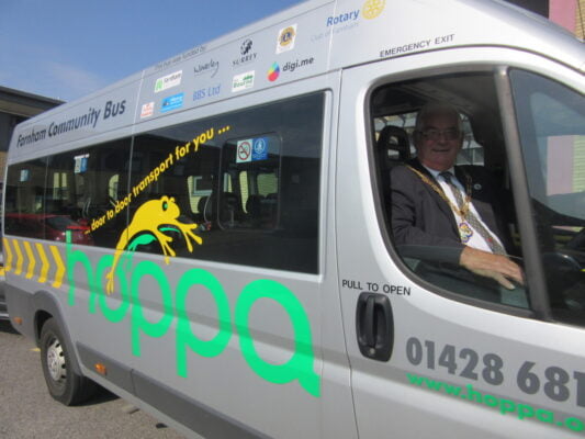 Mayor in driver's seat of a hoppa bus