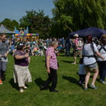 A group of females dancing in the park