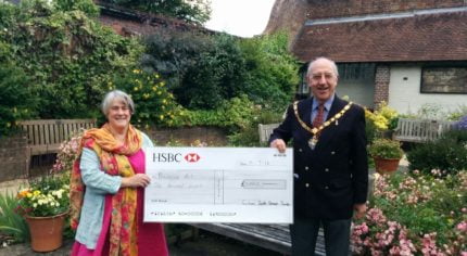 The Mayor of Farnham, Cllr John Ward presents a cheque to Jo Aylwin.