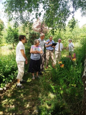 Group of judges in a garden.