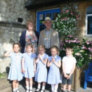 Mayor and Mayoress of Farnham with five school children.