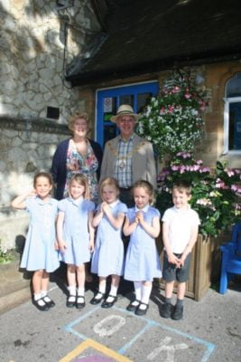 Mayor and Mayoress of Farnham with five school children.