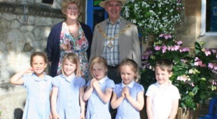 Mayor and Mayoress of Farnham with five school children.