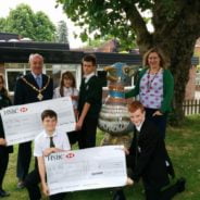 School children receive grant cheque from Mayor.