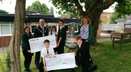 School children receive grant cheque from Mayor.