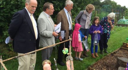 Judges visit an allotment.