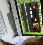 Child sat at a computer.