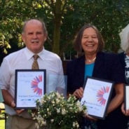 Group of people holding certificates.