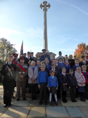 Group of children in front of war memorial