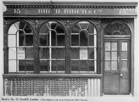 Black and white photo of a shop