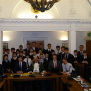 Group of schoolboys in Farnham council chamber with the Mayor of Farnham.