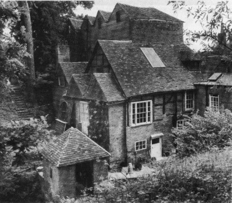 Black and white photo of an old mill building