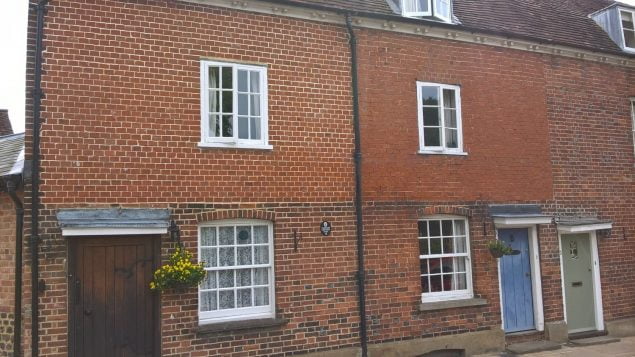 Terraced, red brick cottages.