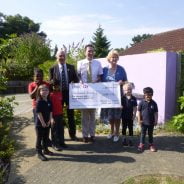 John Ward presents large cheque to the Ridgeway School