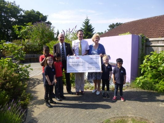 John Ward presents large cheque to the Ridgeway School