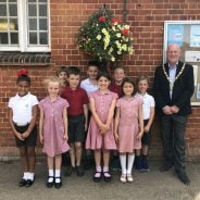 School children with the Mayor and their hanging basket.