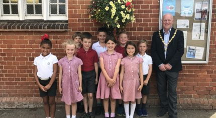 School children with the Mayor and their hanging basket.