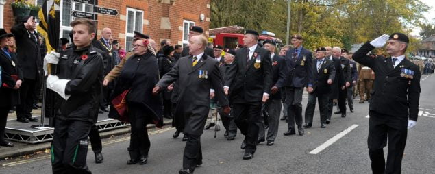 People marching in a remembrance parade.