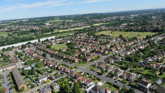 Aerial photo of Farnham houses, trees and fields.