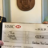 Mayor presents large cheque to a female representing The Simon Trust charity.