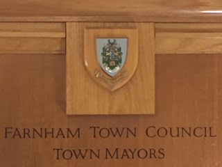 Wooden panel engraved with Farnham Town Council Town Mayors.