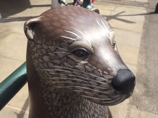 Painted otter sculpture