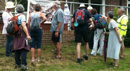 Group of walkers looking at a banner.