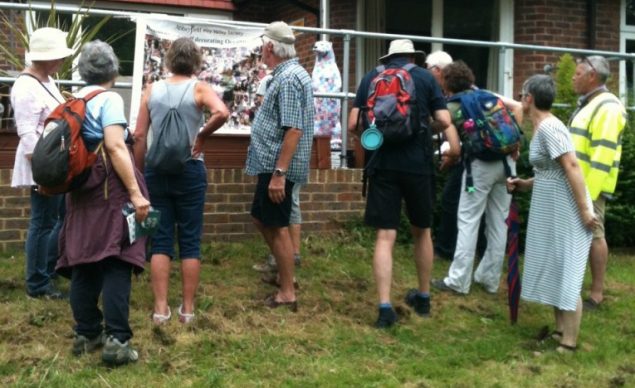 Group of walkers looking at a banner.