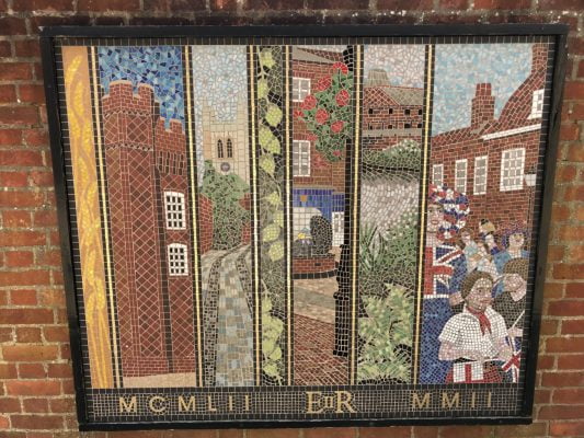 Mosaic showing street scenes.