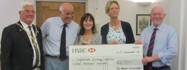 Group of people with a large cheque