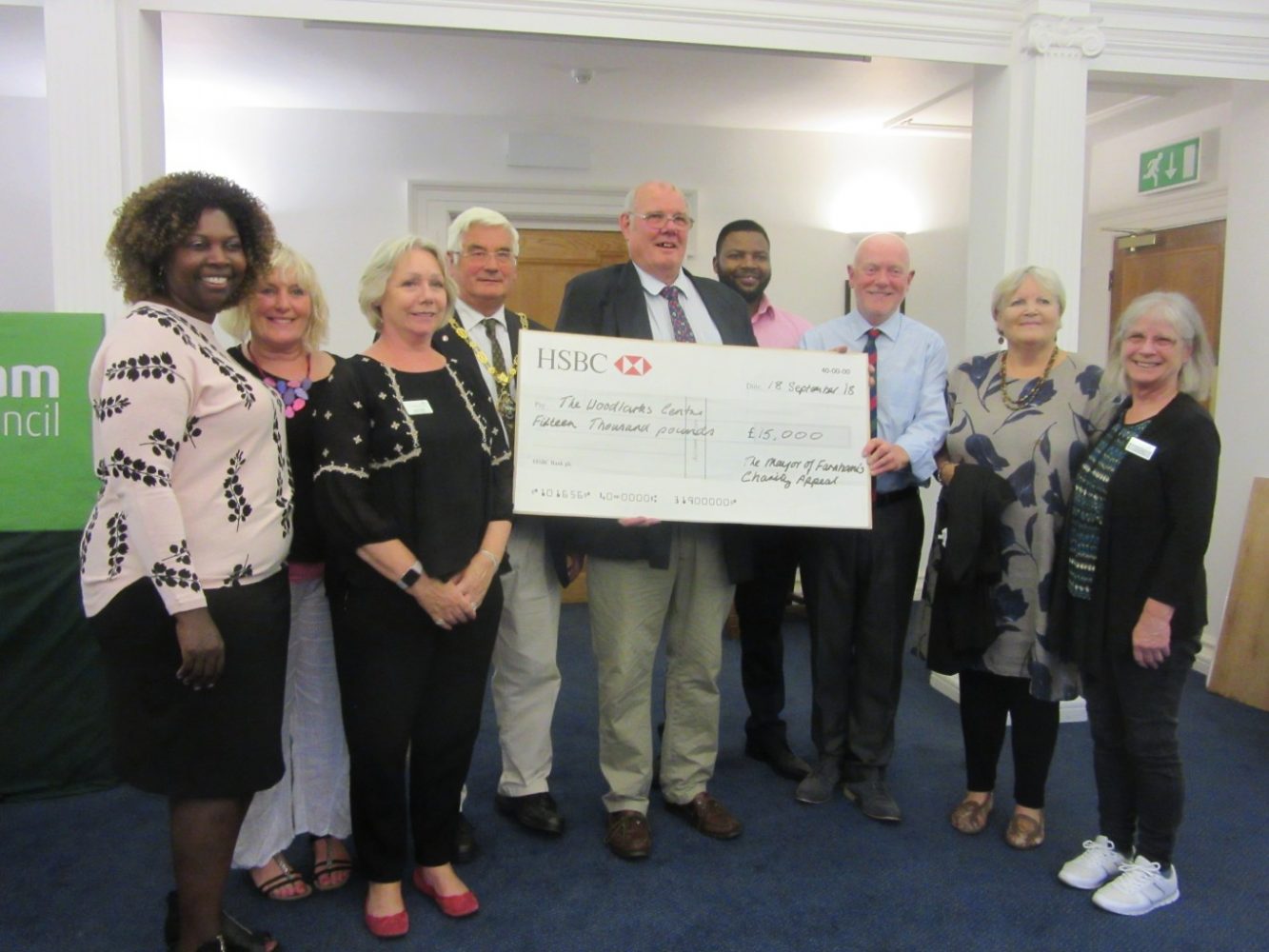 Group of people with a large cheque