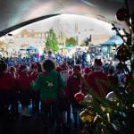 View of crowd from back of stage. Christmas