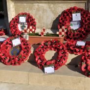 Poppy wreaths at a war memorial