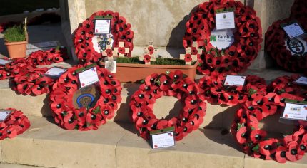 Poppy wreaths at a war memorial