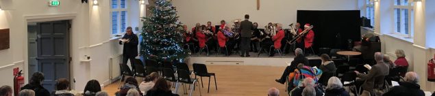 Band playing a concert with audience watching