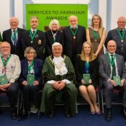 Mayor centre with group of people wearing medals