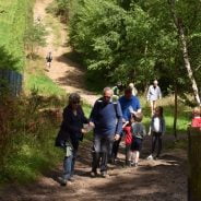 Family walking through woods.