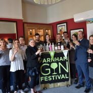 Group of people holding glasses of gin