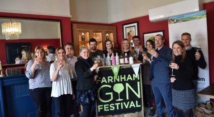 Group of people holding glasses of gin