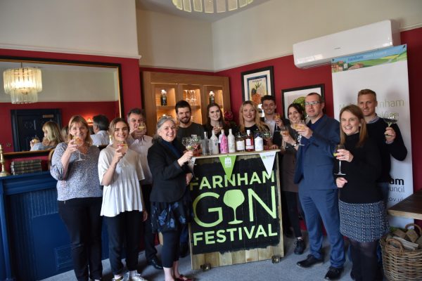 Group of people holding glasses of gin