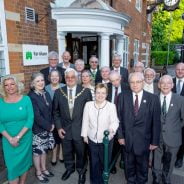 Mayor and group of people standing outside Town Council office.