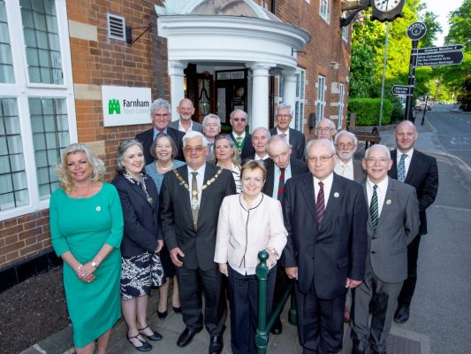 Mayor and group of people standing outside Town Council office.