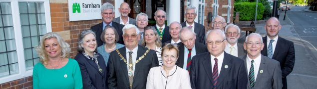 Mayor and group of people standing outside Town Council office.