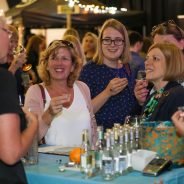 Four females sampling gin