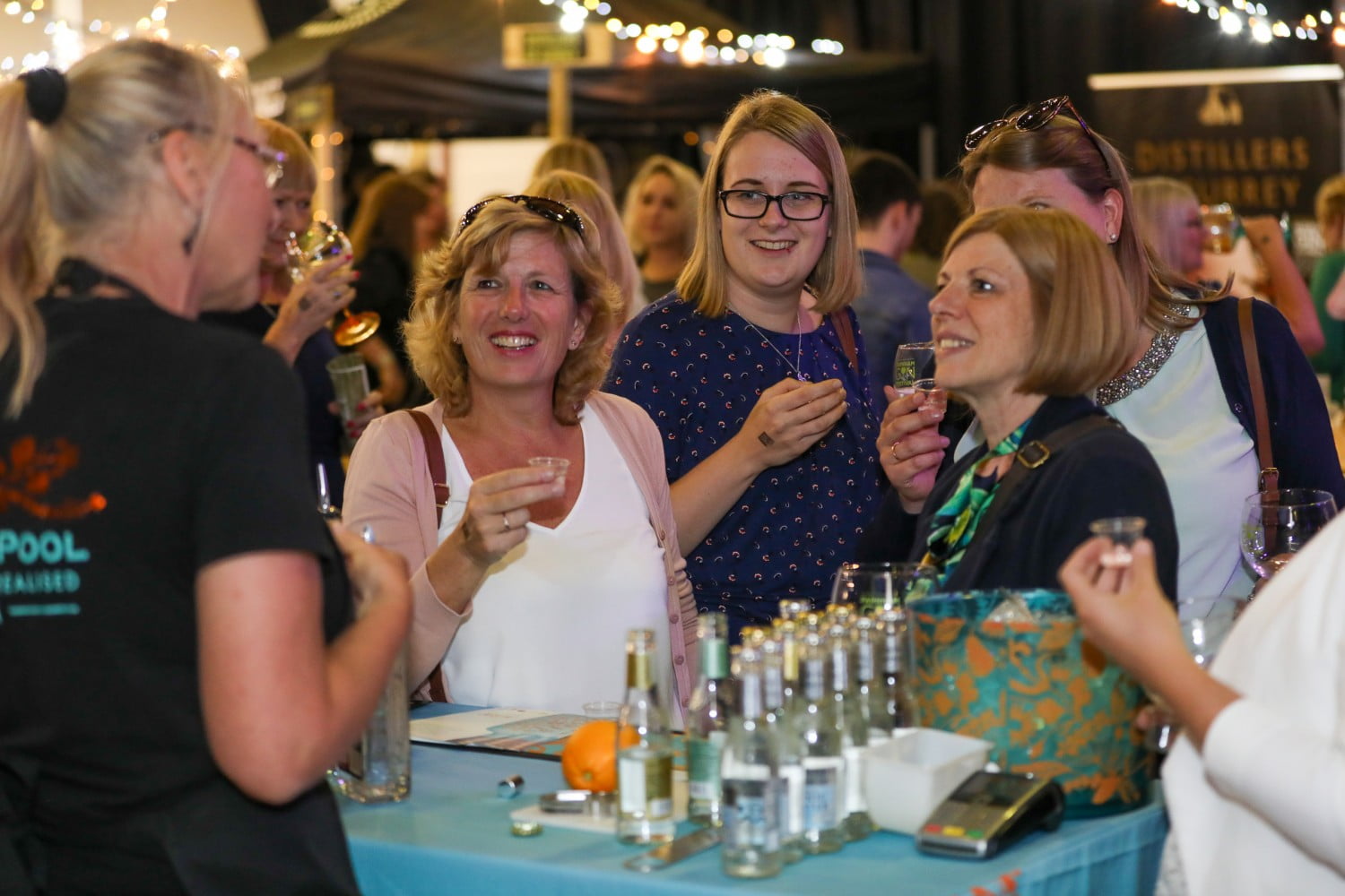 Four females sampling gin