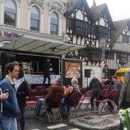 People watching a demonstration at a food festival