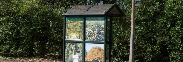 Bus stop decorated with floral pictures.