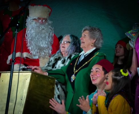 Father Christmas, two females and pantomime characters