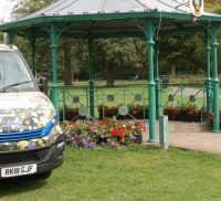 Two vans parked either side of bandstand