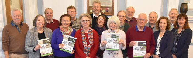 Group of people holding copies of the Farnham Neighbourhood Plan